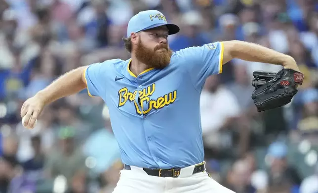 Milwaukee Brewers' Brandon Woodruff pitches during the first inning of a baseball game against the New York Mets, Friday, Aug. 8, 2025, in Milwaukee. (AP Photo/Aaron Gash)