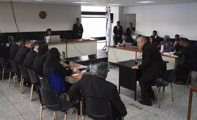 Carlos Rodas, one of seven people accused of responsibility for a fire at a government-run facility for at-risk girls that killed 41 girls in 2017, stands up after speaking during trial at court in Guatemala City, Tuesday, Aug. 12, 2025. (AP Photo/Moises Castillo)