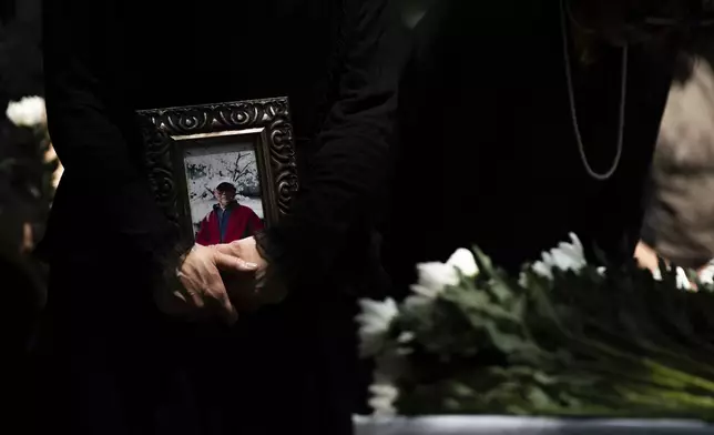 Attendees pay tribute during a remembrance ceremony for Korean victims at the "Monument in Memory of the Korean Victims of the A-bomb", in Hiroshima, Tuesday, Aug. 5, 2025 on the eve of the anniversary of the atomic bombing. (AP Photo/Louise Delmotte)