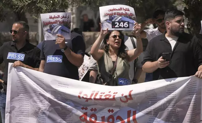 Palestinian and Israeli activists and journalists take part in a protest against the killing of Palestinian journalists in the Gaza Strip, as they gather in Nazareth, Israel, Friday, Aug. 29, 2025. (AP Photo/Mahmoud Illean)