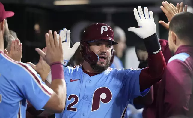 Philadelphia Phillies' Kyle Schwarber reacts after hitting a two-run home run against Atlanta Braves pitcher Austin Cox during the fourth inning of a baseball game Thursday, Aug. 28, 2025, in Philadelphia. (AP Photo/Matt Slocum)