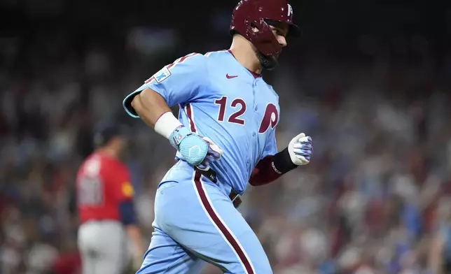Philadelphia Phillies' Kyle Schwarber rounds the bases after hitting a three-run home run against Atlanta Braves pitcher Austin Cox during the fifth inning of a baseball game Thursday, Aug. 28, 2025, in Philadelphia. (AP Photo/Matt Slocum)