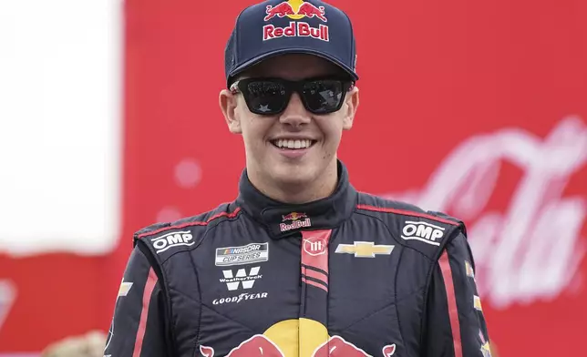 FILE - Connor Zilisch smiles prior to a NASCAR Cup Series auto race at Charlotte Motor Speedway, May 25, 2025, in Concord, N.C. (AP Photo/Matt Kelley, file)