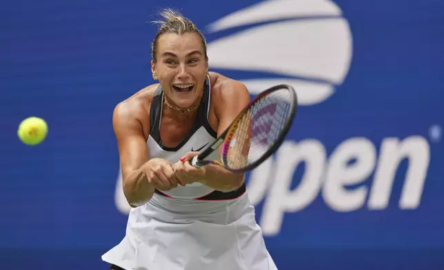 Aryna Sabalenka, of Belarus, returns a shot to Rebeka Masarova, of Switzerland, during the first round of the US Open tennis championships, Sunday, Aug. 24, 2025, in New York. (AP Photo/Kirsty Wigglesworth)
