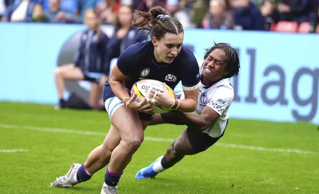 Scotland's Francesca McGhie scores their side's fourth try during the pool B match between Scotland and Fiji, at the 2025 Women's Rugby World Cup, in Manchester, England, Saturday, Aug. 30, 2025. (Mike Egerton/PA via AP)