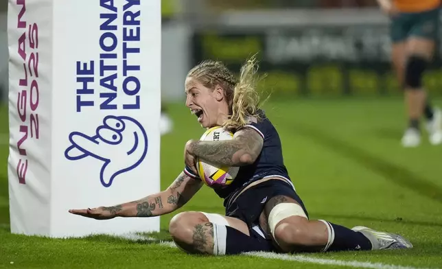 United States' Erica Jarrell-Searcy scores a try against Australia during the Women's Rugby World Cup 2025 Pool A match at York Community Stadium, Saturday, Aug. 30, 2025, in York, England. (Danny Lawson/PA via AP)
