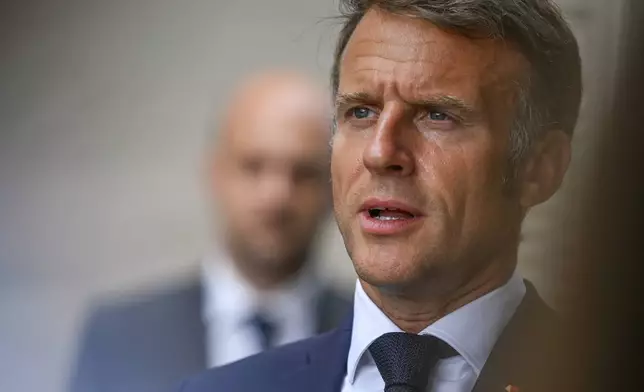 French President Emmanuel Macron speaks during a statement following a video conference on Ukraine at the Fort de Bregancon in Bormes-les-Mimosas, southern France, Wednesday Aug.13, 2025. (Philippe Magoni, Pool via AP)