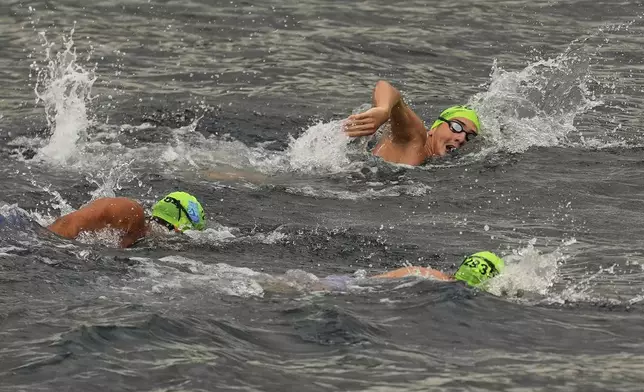 Competitors take part in a 6.5 km swimming race across the Bosphorus Strait, from the Asian side to the European side, in Istanbul, Turkey, Sunday, Aug. 24, 2025. (AP Photo/Khalil Hamra)