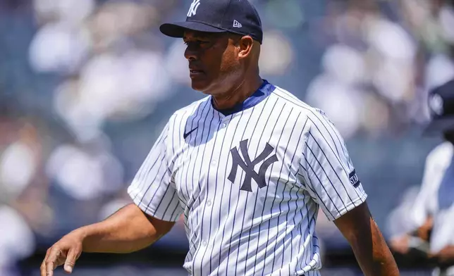 Former New York Yankees' Mariano Rivera (42) walks back to dugout during the first inning of the Yankees Old-Timers' Day Game before a baseball game against the Houston Astros, Saturday, Aug. 9, 2025, in New York. (AP Photo/Yuki Iwamura)