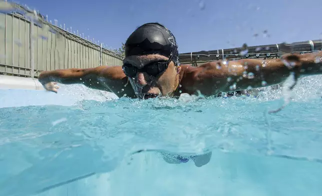 Ukrainian war veteran Pavlo Tovstyk trains in a pool in Kyiv, Ukraine, Saturday, Aug. 16, 2025, during a training session to compete in a 6.5km swimming race across the Bosporus Strai. (AP Photo/Evgeniy Maloletka)
