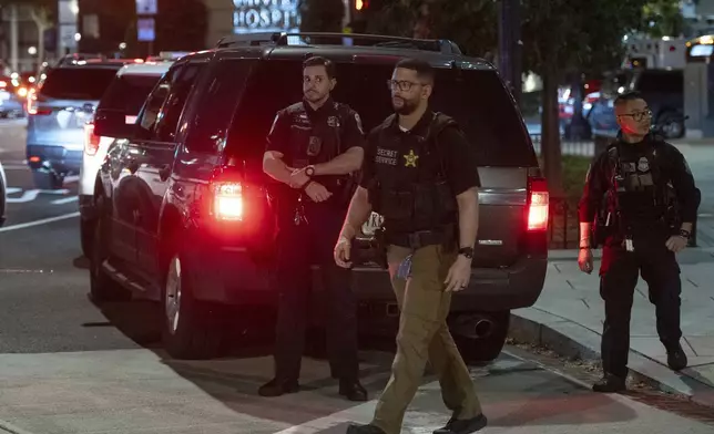 Officer from the Secret Service Uniform Division officers on patrol in the Foggy Bottom neighborhood of Washington, Thursday, Aug. 14, 2025. (AP Photo/Cliff Owen)