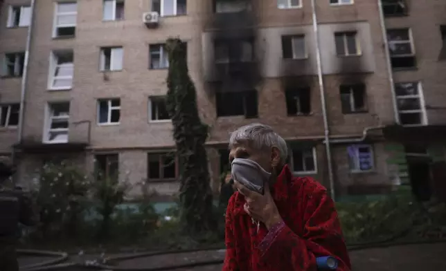 A resident stands near the resident's destroyed home following Russian air strike in Zaporizhzhia, Ukraine, Saturday, Aug. 30, 2025. (AP Photo/Kateryna Klochko)