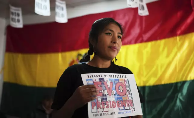 Wendy Chipana, a supporter of former President Evo Morales, gives an interview as she campaigns for a null vote in the upcoming presidential elections in El Alto, Bolivia, Tuesday, Aug. 12, 2025. (AP Photo/Natacha Pisarenko)