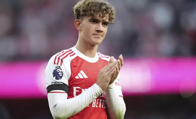 Arsenal's Max Dowman acknowledges the fans after the English Premier League soccer match between Arsenal and Leeds United at Emirates stadium in London, England, Saturday, Aug. 23, 2025. (John Walton/PA via AP)