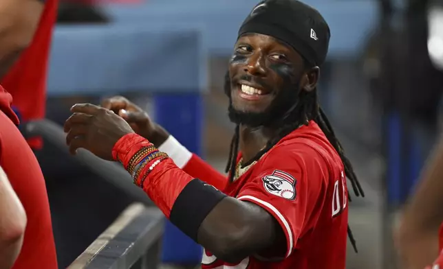 Cincinnati Reds shortstop Elly De La Cruz jokes in the dugout during the fourth inning of a baseball game against the Los Angeles Dodgers Monday, Aug. 25, 2025, in Los Angeles. (AP Photo/Jayne Kamin-Oncea)