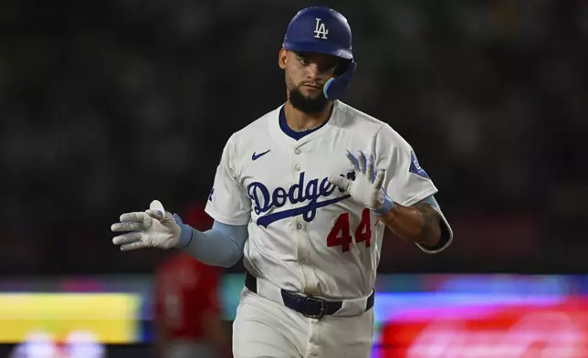 Los Angeles Dodgers' Andy Pages celebrates after hitting a home run during the third inning of a baseball game against the Cincinnati Reds Monday, Aug. 25, 2025, in Los Angeles. (AP Photo/Jayne Kamin-Oncea)