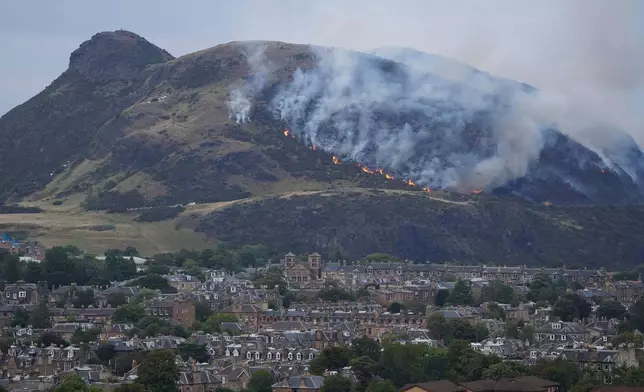 A view of a fire on Arthur's Seat in Holyrood Park, in Edinburgh, Scotland, Sunday Aug. 10, 2025. (Jane Barlow/PA via AP)