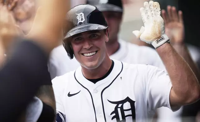 Detroit Tigers' Kerry Carpenter celebrates in the dugout after hitting a two-run home run during the sixth inning of a baseball game against the Arizona Diamondbacks, Wednesday, July 30, 2025, in Detroit. (AP Photo/Ryan Sun)