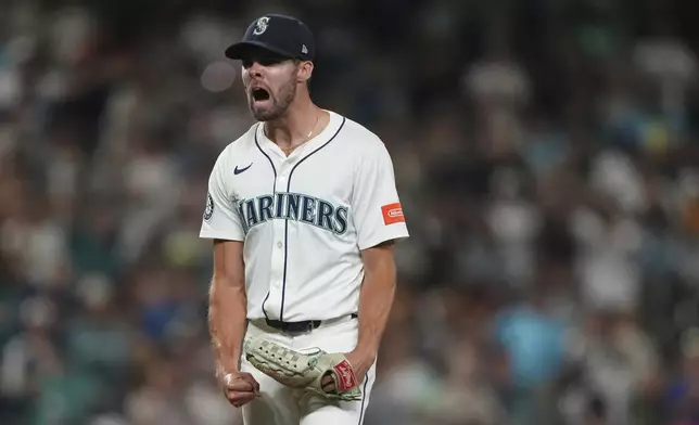 Seattle Mariners relief pitcher Matt Brash reacts to San Diego Padres' Ramon Laureano being called out on strikes with the bases loaded during the eighth inning of a baseball game Monday, Aug. 25, 2025, in Seattle. (AP Photo/Lindsey Wasson)