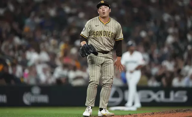 San Diego Padres relief pitcher Yuki Matsui reacts after catching a line drive from Seattle Mariners' J.P. Crawford during the seventh inning of a baseball game Monday, Aug. 25, 2025, in Seattle. (AP Photo/Lindsey Wasson)