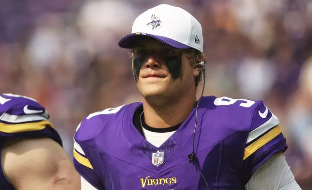 Minnesota Vikings quarterback J.J. McCarthy stands on the sideline during the first half of an NFL preseason football game against the Houston Texans, Saturday, Aug. 9, 2025, in Minneapolis. (AP Photo/Matt Krohn)