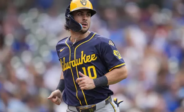 Milwaukee Brewers' Sal Frelick scores on a single hit by Brice Turang during the eighth inning of the first baseball game of a split doubleheader Monday, Aug. 18, 2025, in Chicago. (AP Photo/Erin Hooley)