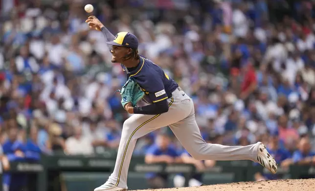 Milwaukee Brewers pitcher Abner Uribe throws against the Chicago Cubs during the seventh inning of the first baseball game of a split doubleheader Monday, Aug. 18, 2025, in Chicago. (AP Photo/Erin Hooley)