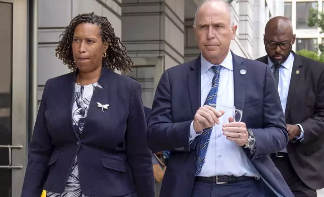 District of Columbia Mayor Muriel Bowser, left, and District of Columbia Attorney General Brian Schwalb walk out of federal court in Washington, Friday, Aug. 15, 2025. (AP Photo/Mark Schiefelbein)