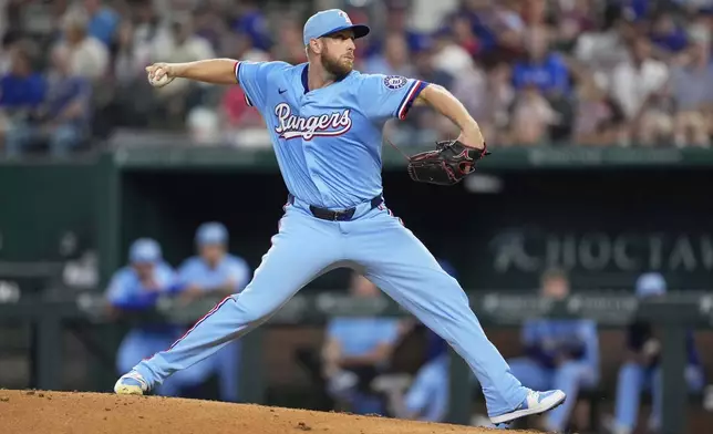 Texas Rangers starting pitcher Merrill Kelly throws to the Cleveland Guardians in the third inning of a baseball game Sunday, Aug. 24, 2025, in Arlington, Texas. (AP Photo/Tony Gutierrez)