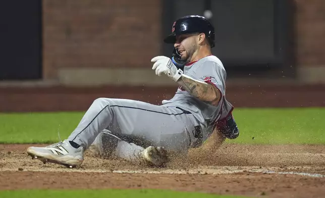Cleveland Guardians' C.J. Kayfus scores on a single by Steven Kwan during the seventh inning of a baseball game against the New York Mets Tuesday, Aug. 5, 2025, in New York. (AP Photo/Frank Franklin II)