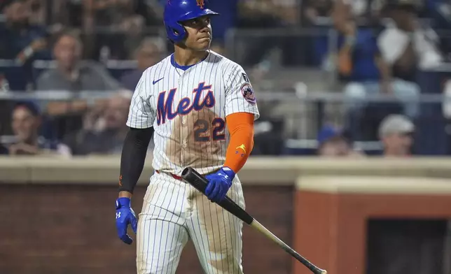New York Mets' Juan Soto reacts after striking out during the eighth inning of a baseball game against the Cleveland Guardians Tuesday, Aug. 5, 2025, in New York. (AP Photo/Frank Franklin II)