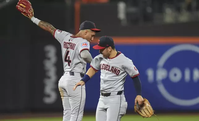 Cleveland Guardians' Brayan Rocchio, left, and Steven Kwan celebrate after a baseball game against the New York Mets Tuesday, Aug. 5, 2025, in New York. (AP Photo/Frank Franklin II)
