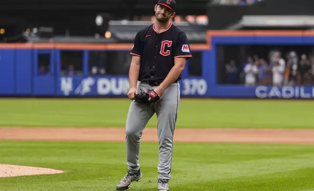Cleveland Guardians pitcher Gavin Williams (32) reacts after giving up a hit during the ninth inning of a baseball game against the New York Mets, Wednesday, Aug. 6, 2025, in New York. (AP Photo/Yuki Iwamura)