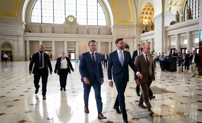 White House Deputy Chief of Staff Stephen Miller, right, Defense Secretary Pete Hegseth and Vice President JD Vance, center, arrive to greet members of the National Guard, at Union Station in Washington, Wednesday, Aug. 20, 2025. (Al Drago/Pool via AP)