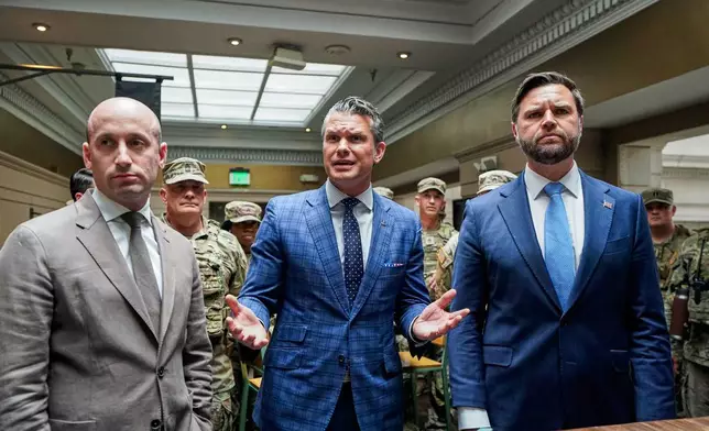 White House Deputy Chief of Staff Stephen Miller, Defense Secretary Pete Hegseth and Vice President JD Vance, greet members of the National Guard at Union Station in Washington, Wednesday, Aug. 20, 2025. (Al Drago/Pool via AP)