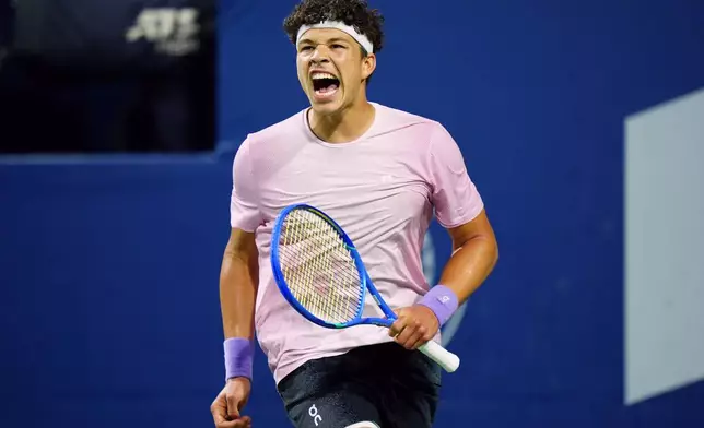 Ben Shelton, of the United States, celebrates after his win over Italy's Flavio Cobolli in their match at the National Bank Open men's tennis tournament in Toronto, Sunday, Aug. 3, 2025. (Frank Gunn/The Canadian Press via AP)