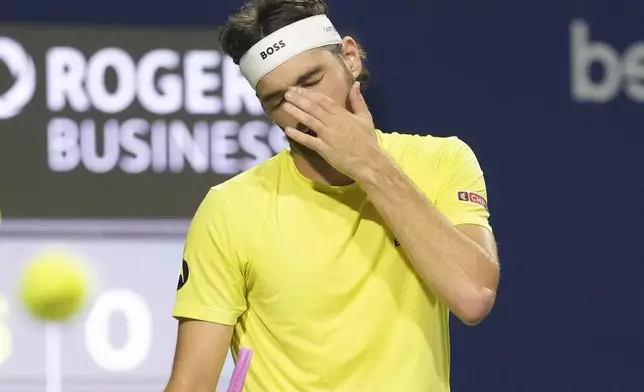 Taylor Fritz, of the United States, reacts during his loss to Ben Shelton, of the United States, after their semifinal match at the National Bank Open tennis tournament in Toronto on Wednesday, Aug. 6, 2025. (Chris Young/The Canadian Press via AP)