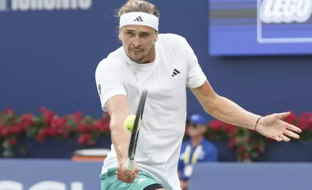 Alexander Zverev, of Germany, hits a return to Karen Khachanov, of Russia, during semifinal tennis action at the National Bank Open in Toronto on Wednesday, Aug., 6, 2025. (Chris Young/The Canadian Press via AP)