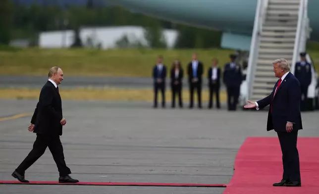 President Donald Trump greets Russia's President Vladimir Putin Friday, Aug. 15, 2025, at Joint Base Elmendorf-Richardson, Alaska. (AP Photo/Julia Demaree Nikhinson)