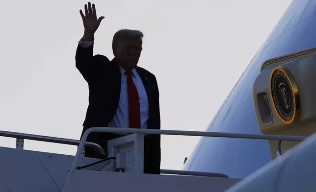 President Donald Trump waves as he boards Air Force One, Friday, Aug. 15, 2025, at Joint Base Andrews, Md. President Trump is traveling to a meeting with Russian President Vladimir Putin today in Alaska at a U.S. military base for a crucial summit. (AP Photo/Julia Demaree Nikhinson)