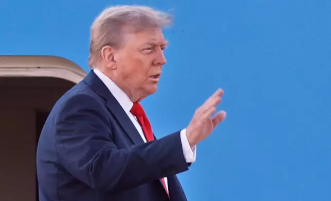 President Donald Trump waves as he boards Air Force One at Joint Base Andrews, Md., Friday, Aug. 15, 2025, en route to a meeting with Russian President Vladimir Putin in Alaska. (AP Photo/Luis M. Alvarez)