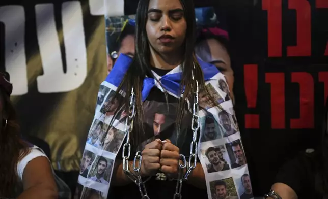 Relatives and supporters of Israeli hostages held in the Gaza Strip attend a rally demanding their release from Hamas captivity and calling for an end to the war outside the prime minister's office in Jerusalem, Thursday, Aug. 7, 2025. (AP Photo/Ohad Zwigenberg)