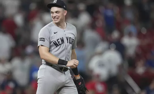 New York Yankees' Ben Rice celebrates a victory over the St. Louis Cardinals following a baseball game Saturday, Aug. 16, 2025, in St. Louis. (AP Photo/Jeff Roberson)