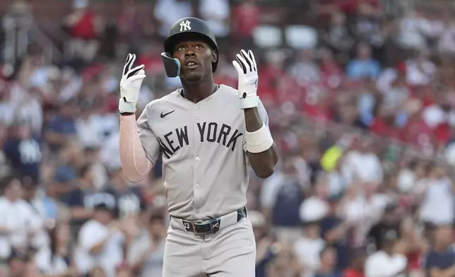 New York Yankees' Jazz Chisholm Jr. arrives home after hitting a two-run home run during the first inning of a baseball game against the St. Louis Cardinals Friday, Aug. 15, 2025, in St. Louis. (AP Photo/Jeff Roberson)