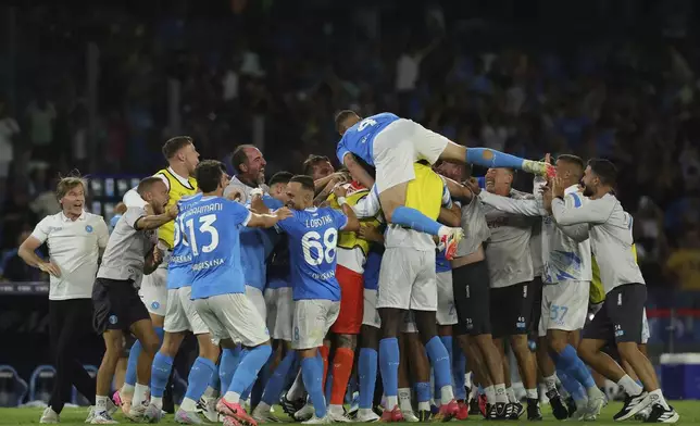 Napoli players celebrates teammate Andre-Frank Zambo Anguissa's goal during the Serie A soccer match between Napoli and Cagliari at the Diego Armando Maradona Stadium in Naples, southern Italy, Saturday, Aug. 30, 2025. (Alessandro Garofalo/LaPresse via AP)