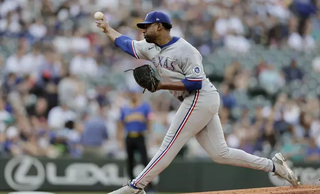 Texas Rangers starting pitcher Kumar Rocker throws against the Seattle Marinersduring the first inning in a baseball game Thursday, July 31, 2025, in Seattle. (AP Photo/John Froschauer)