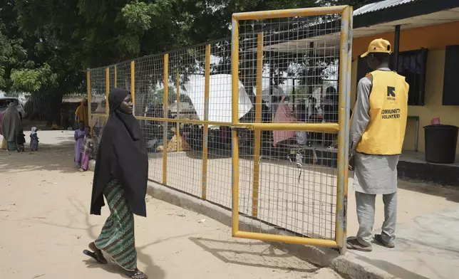 Falmata Muhammed, who once lost her pregnancy, arrives for a checkup at a facility run by aid group International Rescue Committee, in Magumeri, in northeast Nigeria's Borno state, Tuesday, July 22, 2025. (AP Photo/Sunday Alamba)