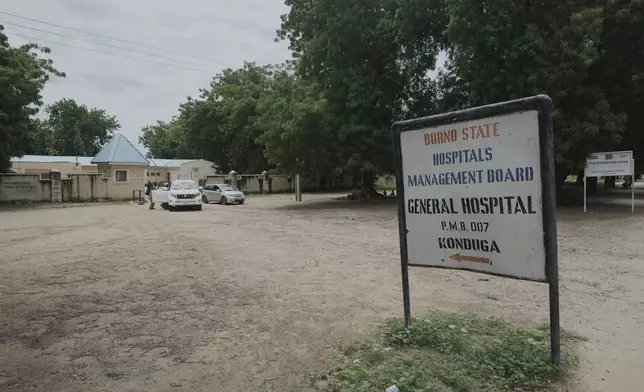 Cars are parked at the entrance of a government hospital in Konduga, northeast Nigeria's Borno state, Wednesday, July 23, 2025. (AP Photo/Sunday Alamba)