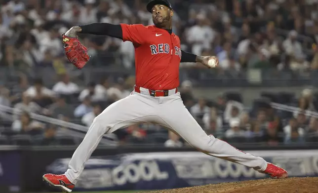 Boston Red Sox pitcher Aroldis Chapman throws during the ninth inning of a baseball game against the New York Yankees, Friday, Aug. 22, 2025, in New York. (AP Photo/Pamela Smith)