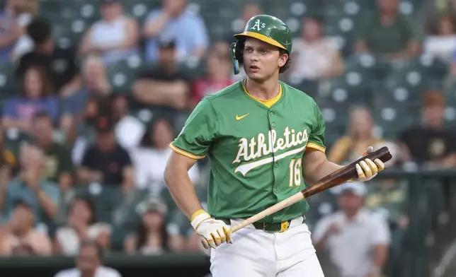 Athletics' Nick Kurtz walks to the dugout after striking out during the first inning of a baseball game against the Texas Rangers Friday, Aug. 29, 2025, in West Sacramento, Calif. (AP Photo/Sara Nevis)